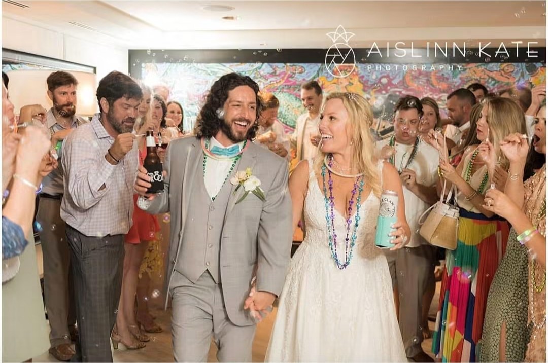 Couple celebrating with their guests on the dance floor